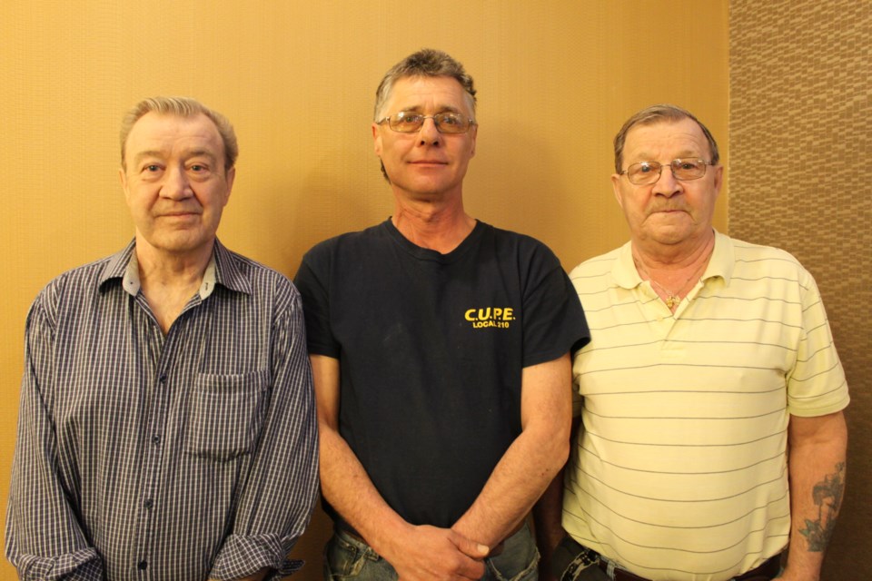 From left, Rolly Carriere, Danny Hway, and Fern Carriere recall the use of McIntyre Powder at McIntyre Mine in Timmins. Photo: Lindsay Kelly