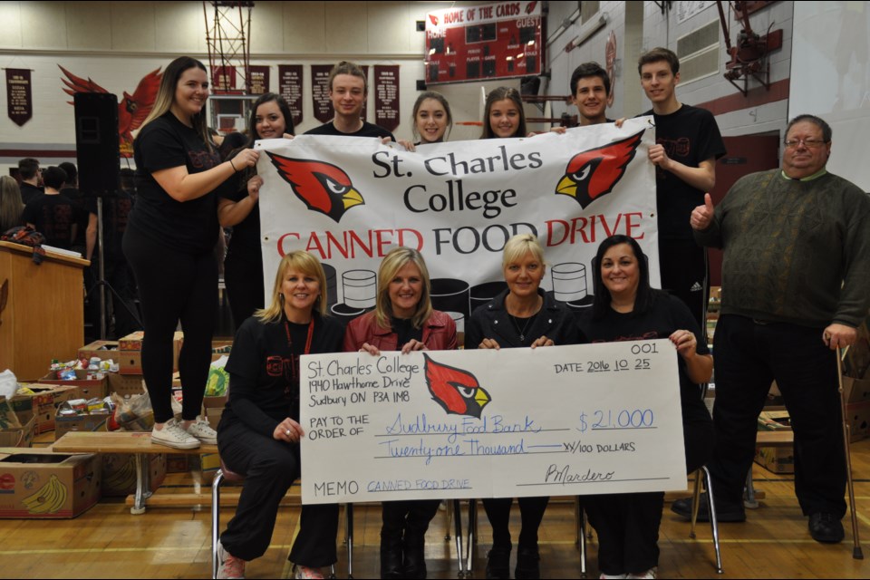 St. Charles College presented the Sudbury Food Bank a cheque for $21,000 recently, along with the food items collected by students. Supplied photo