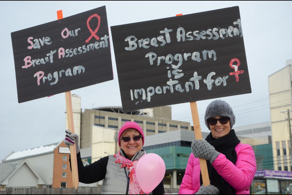 Dozens of people protested outside of Health Sciences North Monday to put pressure on hospital administration not to make cuts to its breast assessment program. (Arron Pickard/Sudbury.com)