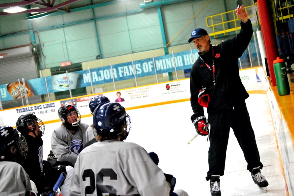 Former NHLer Mike Foligno instructs under-16 youths at the Gerry McCrory Countryside Sports Complex on Thursday.