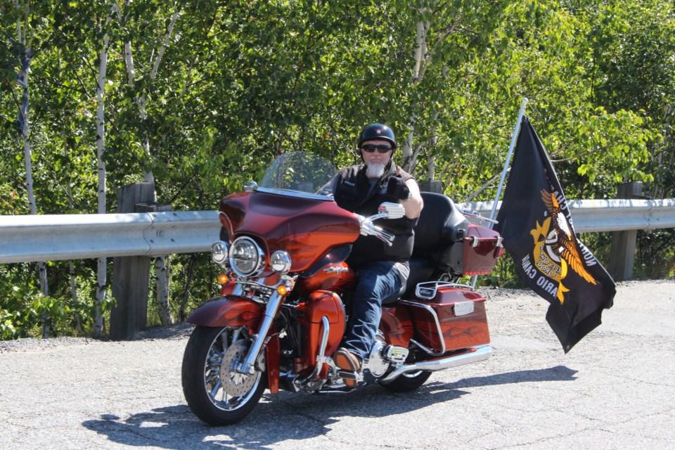 Dave Larsen, president of the Timmins HOG chapter, took part in a Harley Davidson parade Saturday, where hundreds of enthusiasts rode from the Countryside Arena to Bell Park. Photo by Jonathan Migneault.