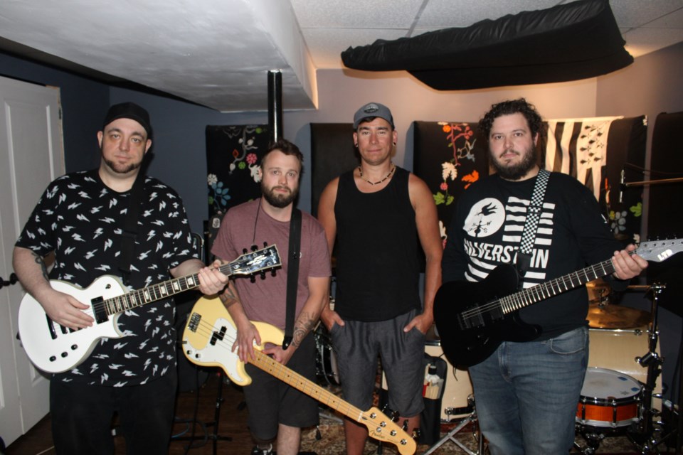 Greater Sudbury rock band The Honour is pictured in their basement rehearsal space in Garson. From left is guitarist/singer Jamie Rowlings, bass player Jody Holinshead, drummer Robert Harris and guitarist Michael Aldred. 
