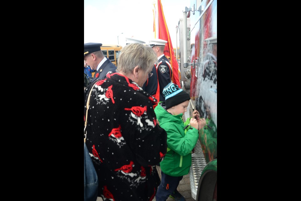 Those attending the Remembrance Day ceremony at the Sudbury Arena today were able to check out a fire truck decorated to raise awareness of the impending 100th anniversary of the Battle of Vimy Ridge. Photo by Arron Pickard.