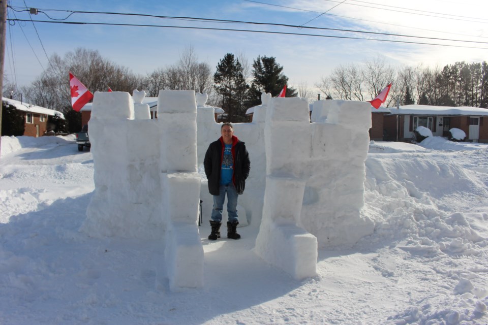Elie Ouellette and his family constructed an adult-sized snow fortress in their front yard located on Caribou Road in New Sudbury. Photo by Heather Green-Oliver.