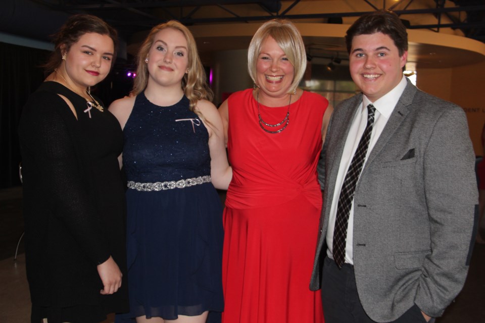 A fundraising gala Friday night raised funds for the Northern Cancer Foundation in breast cancer survivor and Sudbury Secondary School teacher Vicki Ashick-Faux's honour. From left are Lauren Dore, Abby Loiselle, Vicki Ashick-Faux and Ben MacKenzie. Photo by Heidi Ulrichsen.