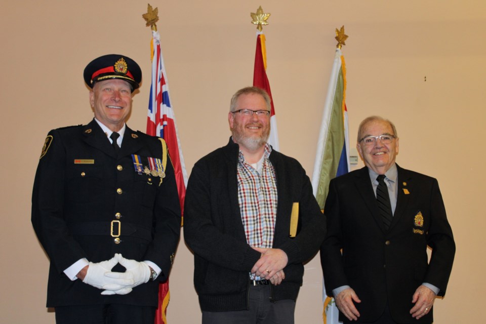 Greater Sudbury police Chief Paul Pedersen, chaplain John Felsman, and police board chair Al Sizer are seen during Felsman’s swearing in on Wednesday.