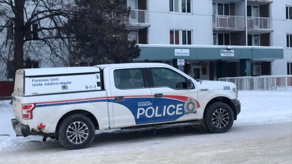 A Greater Sudbury Police forensic vehicle is parked outside an apartment building on Bruce Avenue this morning following a shooting.