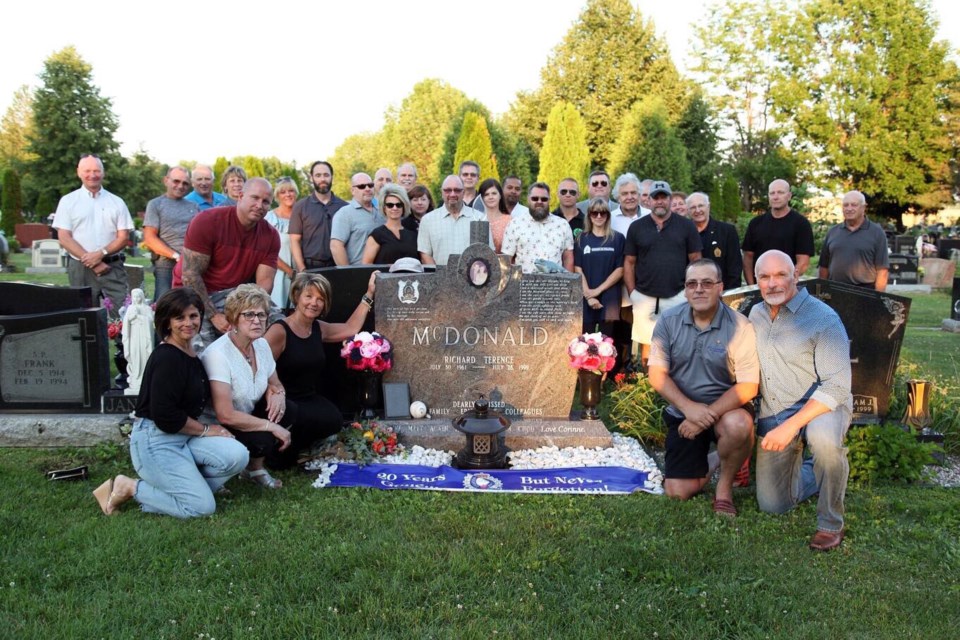 A graveside memorial service was held July 28 to mark the 20th anniversary of the death of Sgt. Rick McDonald of Sudbury Regional Police. (Supplied/Twitter)