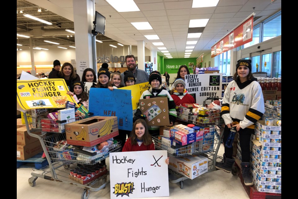 Peewee teams from the Sudbury and District Girls Hockey Association came together Dec. 7 to collect cash and food for the Sudbury Food Bank as part of the Hockey Fights Hunger campaign. (Supplied)