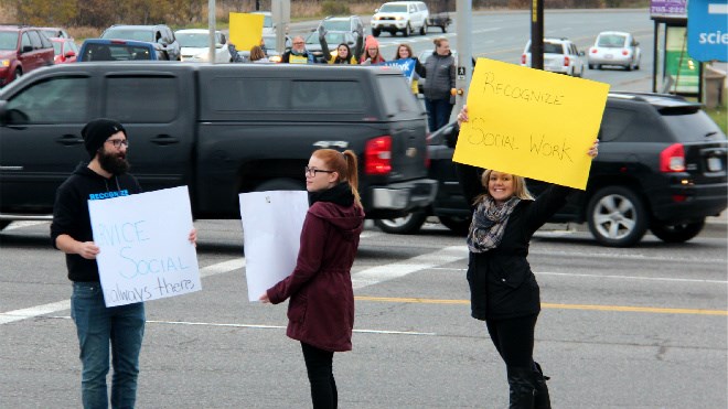 Dozens of students from Laurentian University's School of Social Work rallied by Science North on Wednesday afternoon in support of the program, which is under accreditation review by the Canadian Association of Social Work Educators. Darren MacDonald photos. 
