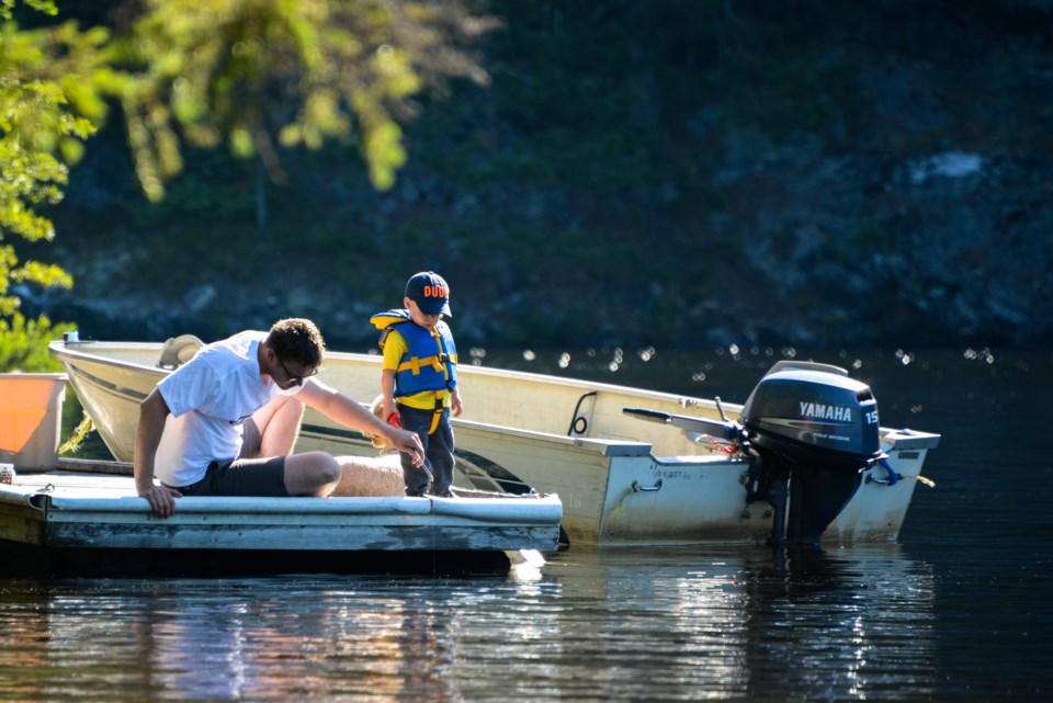 father-son-in-boat-fishing