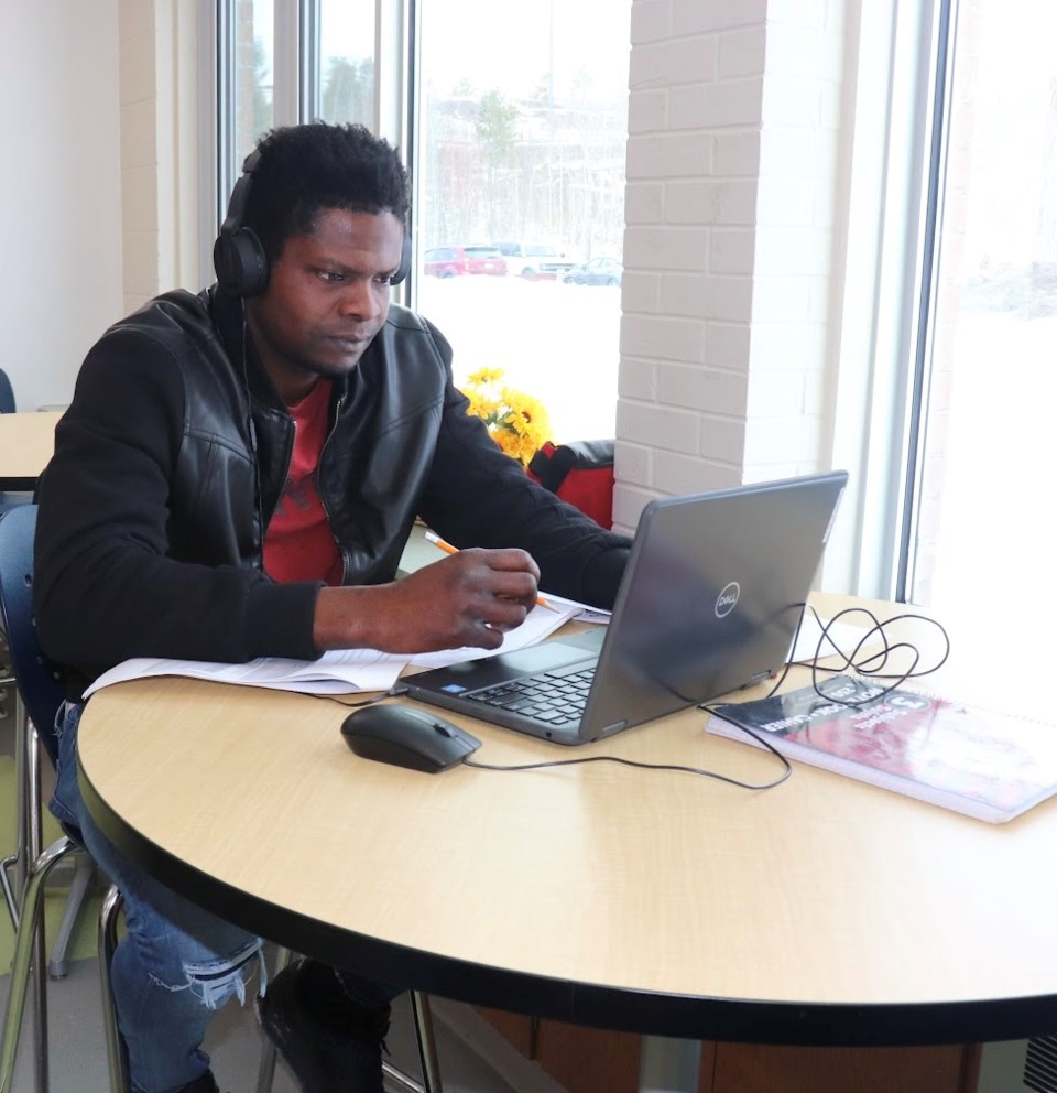 Man works on his laptop