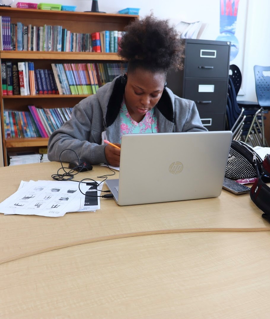 Women works on her laptop