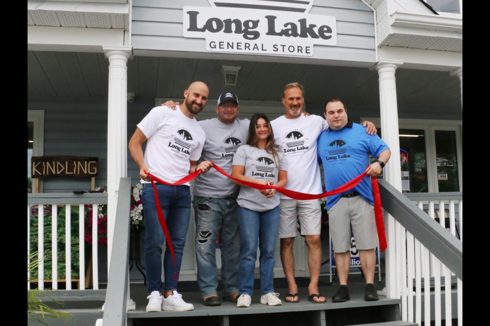 The familiar Long Lake convenience store has been reopened as the Long Lake General Store. Taking part in the new reopening event were, left to right, Nick Foligno, Frank Grossi, Gianna Grossi, Mike Foligno and Ryan Nesci.