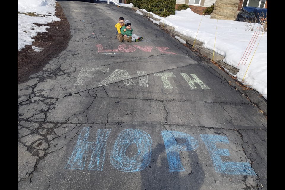 Ryan Joseph, 5, and his little brother Luke offered words of encouragement to their neighbours in Minnow Lake amidst the COVID-19 pandemic. (Gillian Joseph)