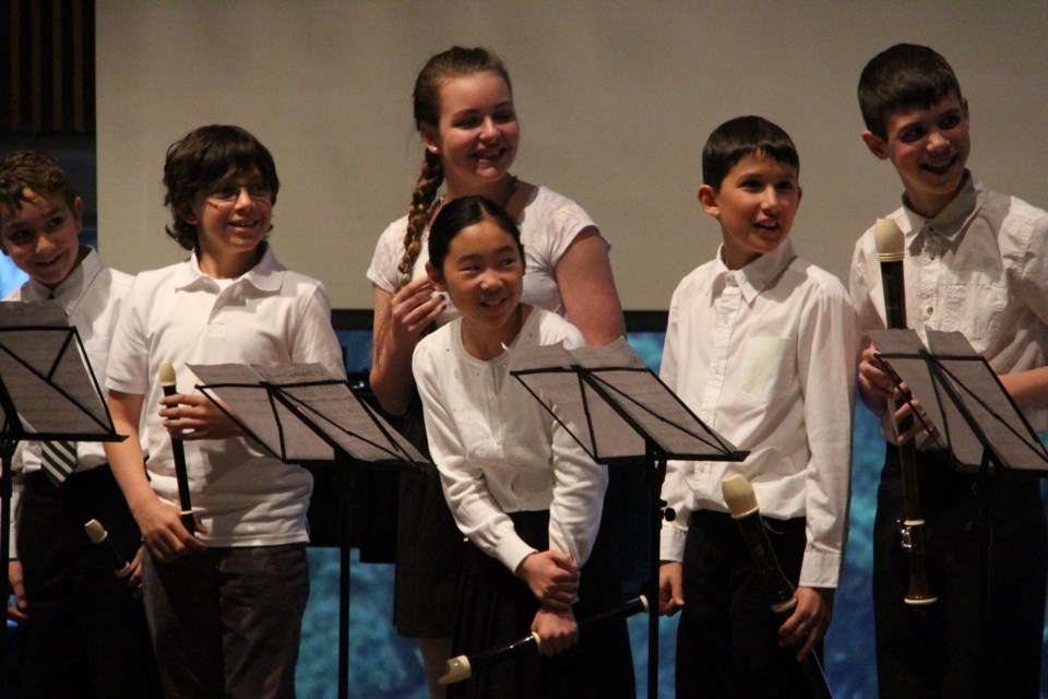 The John Paul II recorder ensemble prepares for their performance at the Kiwanis Stars of Excellence concert on April 18. Photo: Matt Durnan