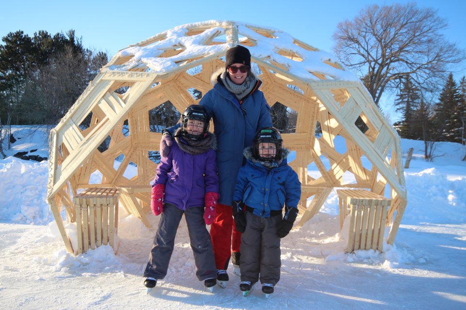 Kim Frawley along with daughter Mavis and son Levi took to the Ramsey Lake skating path Thursday night and got to check out the shelters for skaters built by the Laurentian architecture students. Photo: Matt Durnan