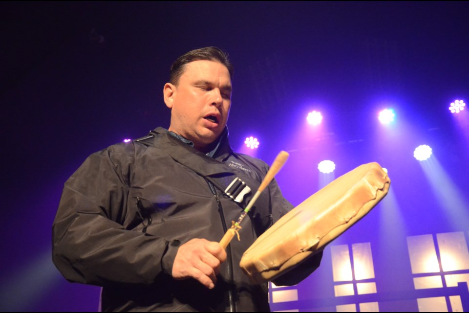 Brad Robinson, the cultural resource coordinator with N'Swakamok Native Friendship Centre, performs a welcoming song at the media launch of Reading Town Sudbury on Wednesday at Theatre Cambrian. (Arron Pickard)