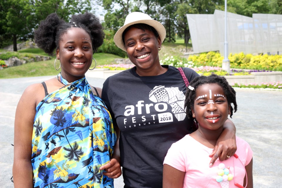 Organizer and co-founder of Afrofest Tonye Oriakhi (centre), standing with daughter's Odosa (left) and Tino (right) at the second annual Afrofest. (Keira Ferguson/ Sudbury.com)