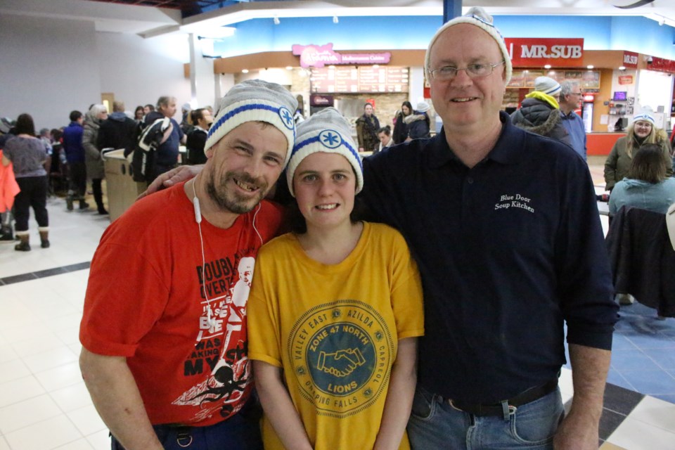 (From the left) Willy and Jenn Curtis, volunteers of Blue Door Soup Kitchen with operation manager, Bill Hickey, at Greater Sudbury's 9th annual Coldest Night of the Year fundraiser in support of the Samaritan Centre. (Keira Ferguson/ Sudbury.com)