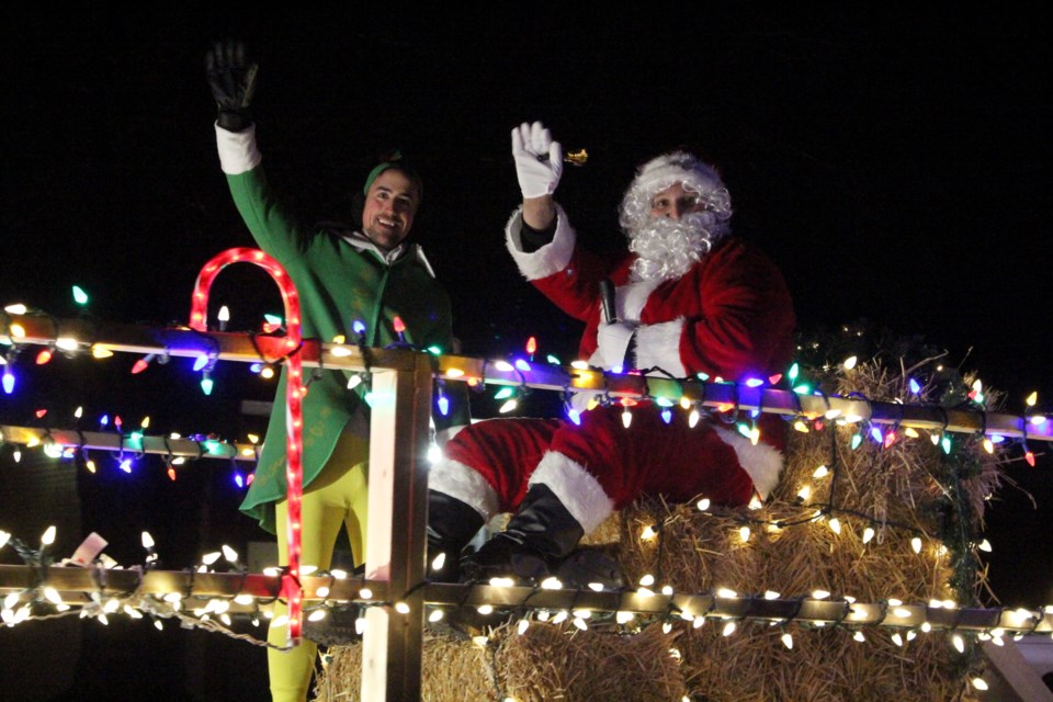 Santa and his elf in the Coniston Christmas Parade.