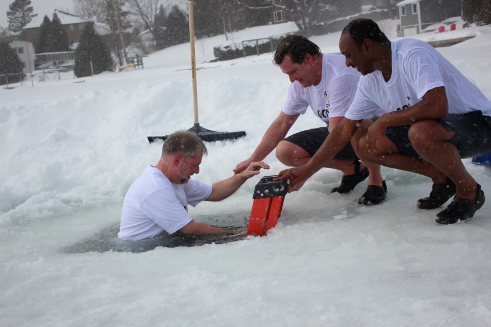 That's some baptism! Catholic clergy take icy plunge into Ramsey - Sudbury  News