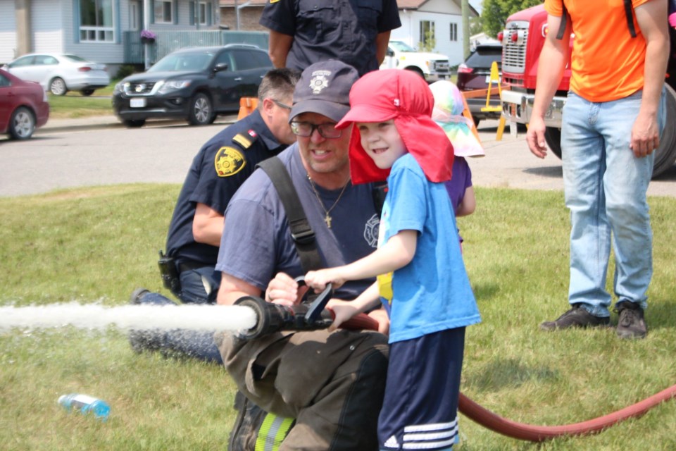 Jacob Lortie, 6, tries out the fire hose at Rayside-Balfour Days in Cote Park in Chelmsford June 10. 