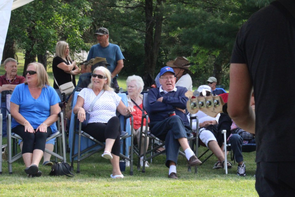 The audience watches Wild Horses perform at Anderson Farm Museum on Wednesday during the first in a series of Wednesday evening concerts at the Lively historical site. 