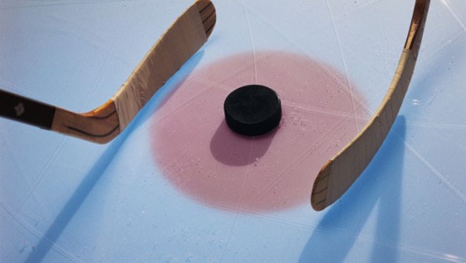 Ice-Hockey-Puck-And-Sticks-In-Faceoff-credit-Stockbyte-78457119-630x419