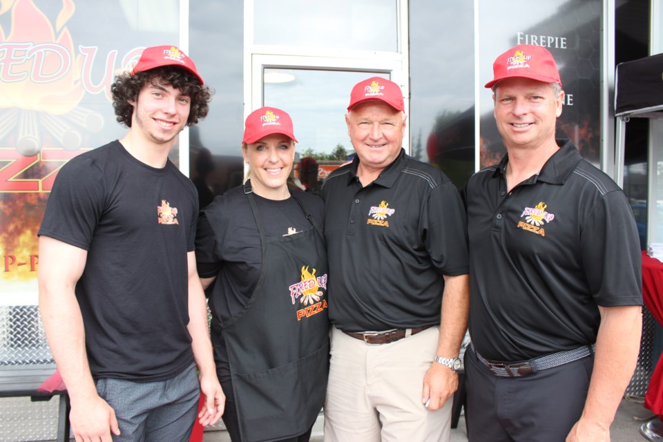 (L to R) Brennen Chaput, co-owner Fired Up Pizza, MJ Pappin-Lamoureux, owner/operator Fired Up Pizza Azilda, Randy Carlyle, Rob Chaput, co-owner and founder of Fired Up Pizza. Photo: Matt Durnan