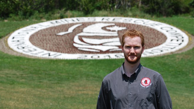 Ted Hanley, Ontario Mine Rescue General Manager, standing in front of the flower garden at Bell Park. Supplied photo. 