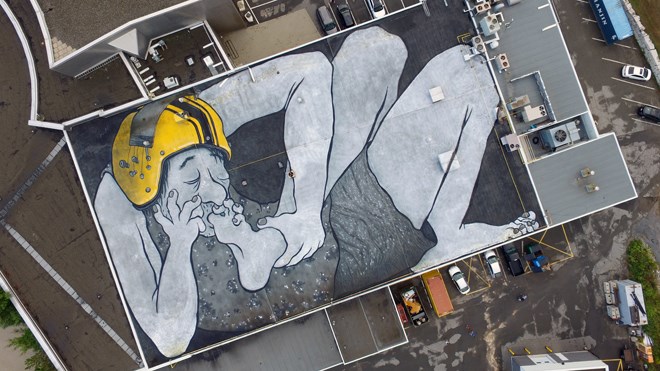 The large rooftop mural by French artists Ella and Pitr atop Science North depicts Michael Persinger and Stanley Koren's 'God Helmet' on a sleeping giant. Photo: Ella and Pitr.