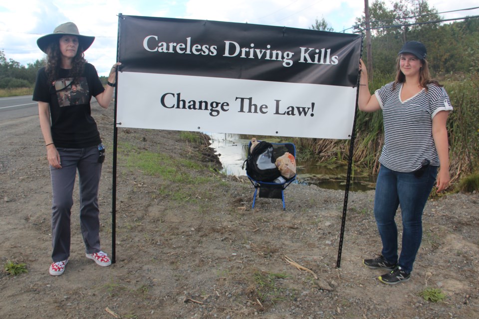 Teresa and Freyja Sankey stood on the side of Highway 17 on Aug. 31, close to the site where 20-year-old Saoirse Sankey was struck and killed by a truck in 2012. The mother and daughter are advocating for changes to the Highway Traffic Act to make penalties stiffer for drivers charged with careless driving who cause someone's death. Photo by Heidi Ulrichsen.