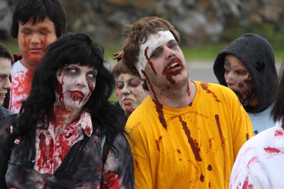 A horde of roughly 20 zombies sidled out of the Science North parking lot and up Paris Street on Oct. 1 during the Nickel City Roller Derby's annual Zombie Walk.