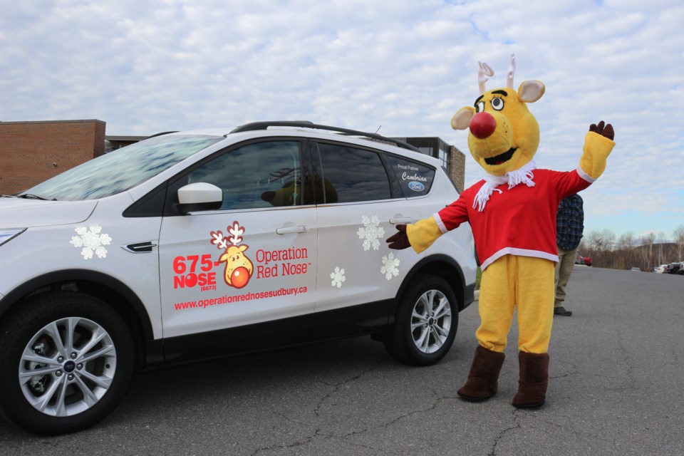 Operation Red Nose mascot, Rudy, encourages people to volunteer for the program, which provides free rides to anyone who has been drinking or who simply does not feel fit to drive his/her vehicle home. Photo by Heather Green-Oliver.