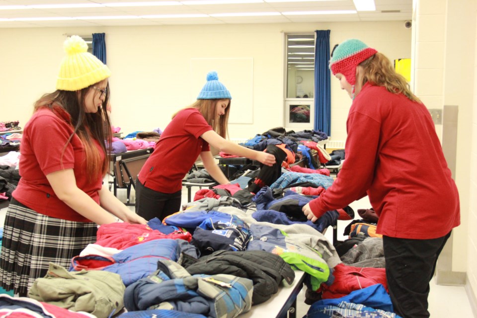 On Nov. 24, École secondaire catholique Champlain (Chelmsford) students and staff hosted an open house in support of the community’s Winter Clothing Drive organized by Our Children, Our Future. Supplied photo.