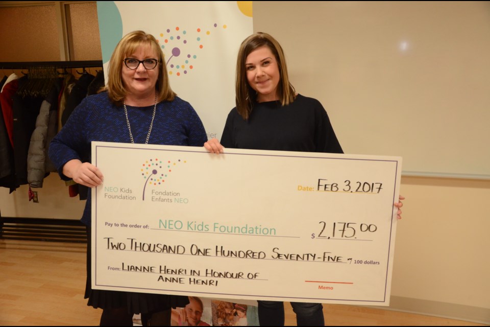 Lianne Henri presents a cheque for $2,175 to NEOKids Foundation president Patricia Mills. Photo by Arron Pickard.