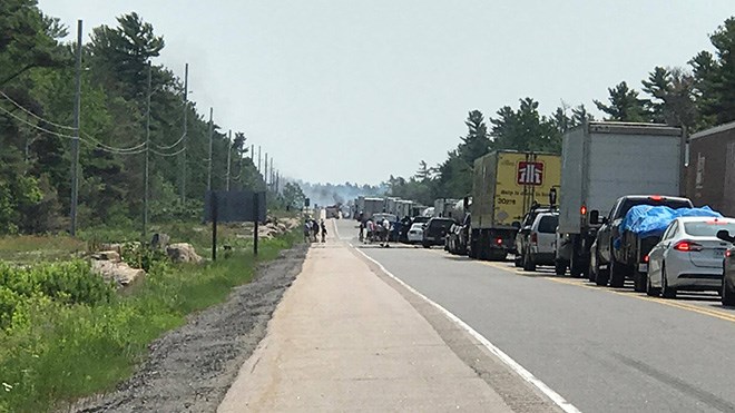 The OPP is warning drivers that a burning vehicle has closed Highway 69 north of Parry Sound. (Photo: Dave Lloyd)
