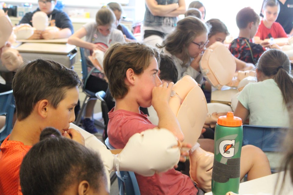 Students in Grades 6 through 8 received a CPR Anytime kit, which includes an instructional DVD and inflatable mannequin, to bring home and practice CPR with their families. (Heather Green-Oliver/Sudbury.com)