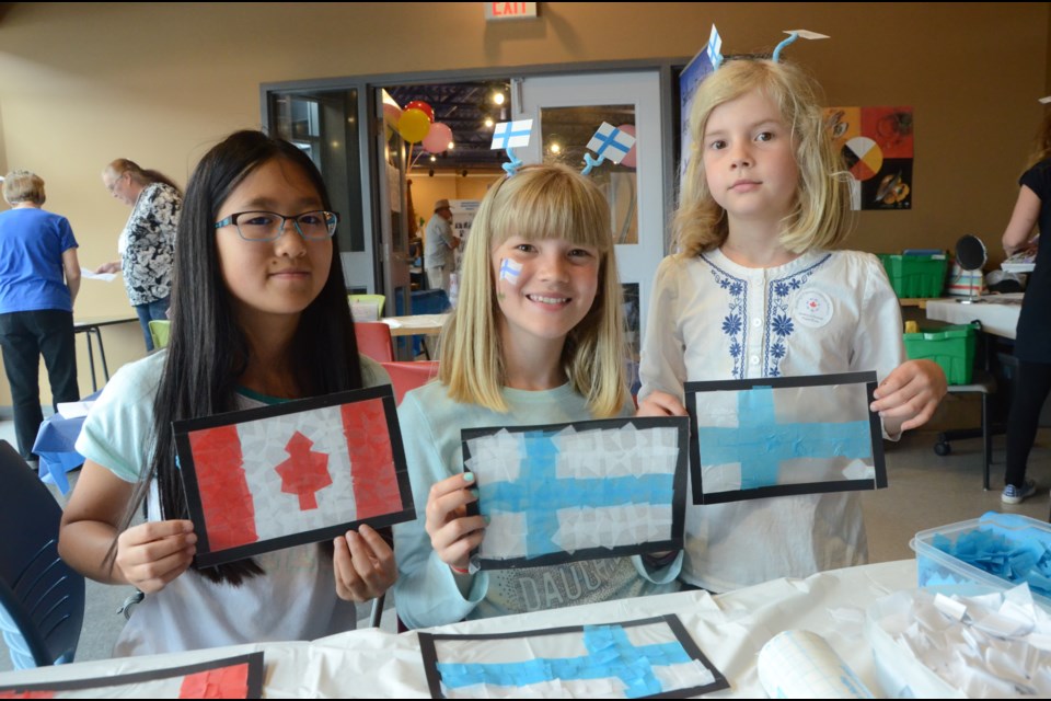 Showing their skills at making flags is, from left, Melissa Wen, 12, Heli Maki, 11, and Lea Maki, 9. (Arron Pickard/Sudbury.com)
