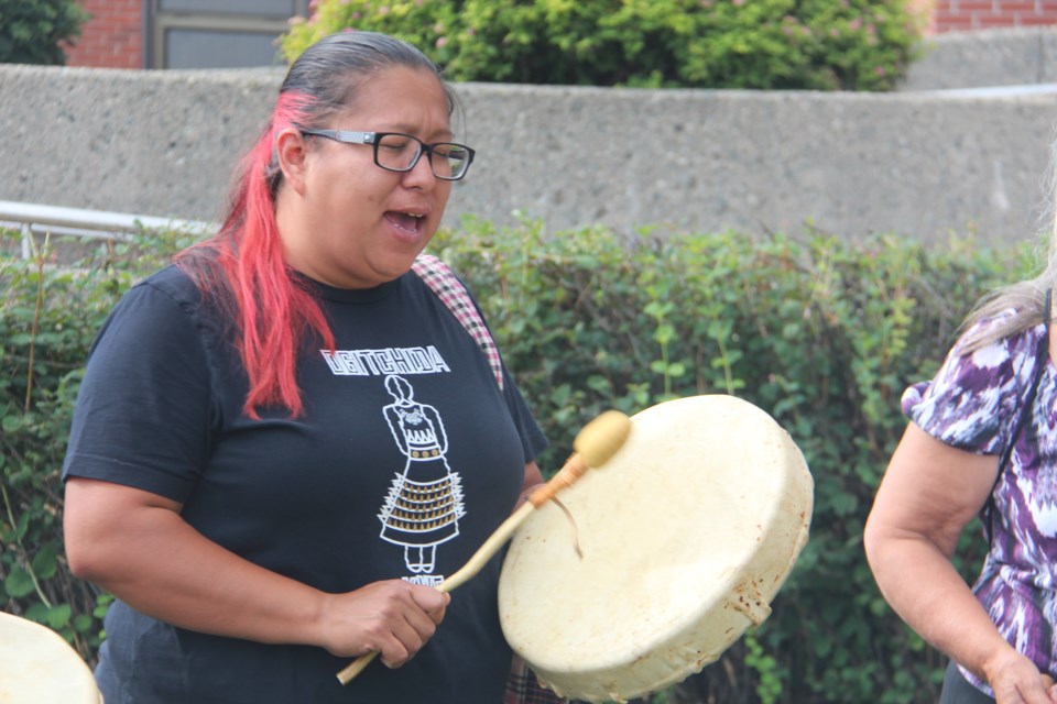 Crystal Kimewon, a member of the N'Swakamok Women's Hand Drummers, performs as part of the Prisoners' Justice Day ceremony outside of the Sudbury Jail Aug. 10. (Heidi Ulrichsen/Sudbury.com)