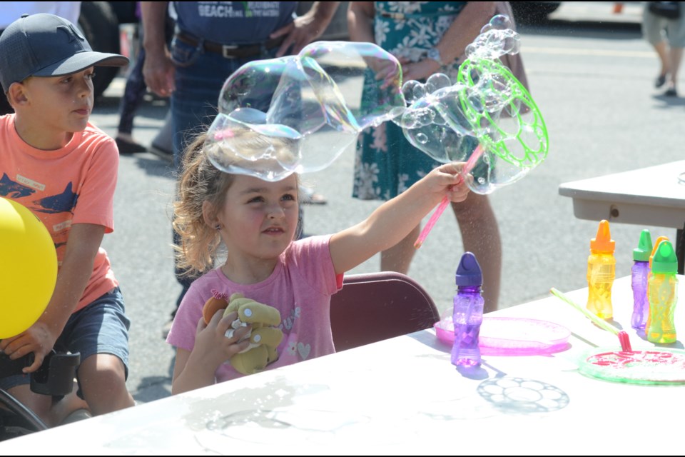Tianna Guilbeault, 4, creates bubbles at New Sudbury Days at the New Sudbury Centre. (Photo: Arron Pickard)