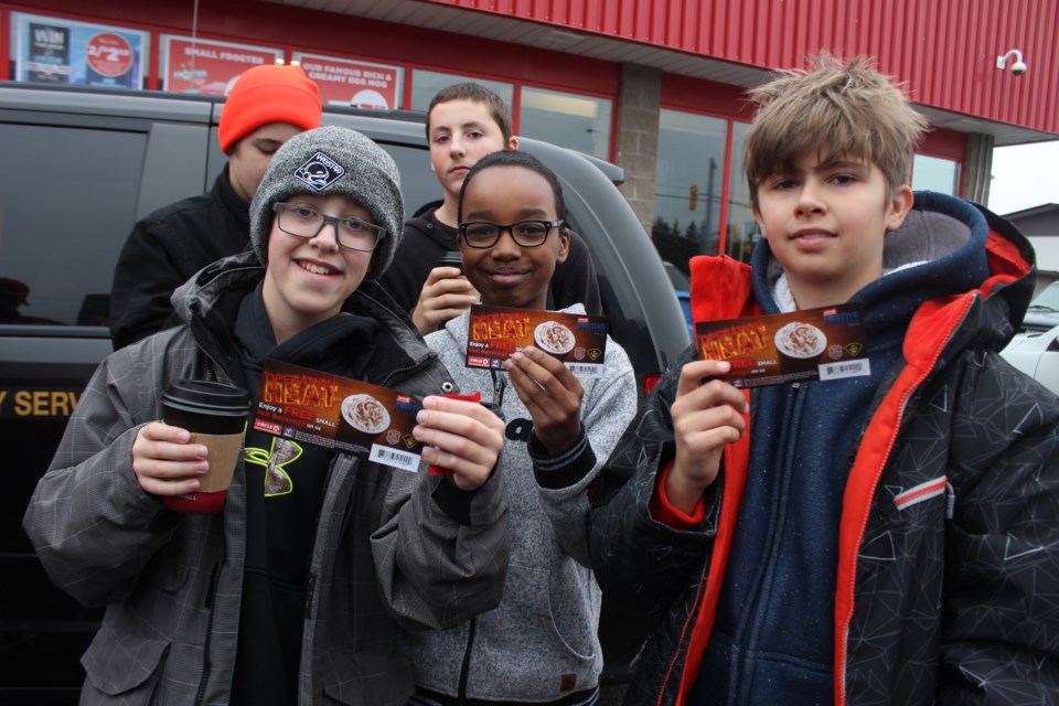 Officers who observe youth doing random acts of kindness or exhibiting positive behaviour this winter will recognize that young person with a "positive ticket", which is actually a coupon for a free hot chocolate at all participating Mac's stores across Ontario.  Left to right are École Publique Pavillon-De-L'Avenir Grade 7 students: Nicholas Rheault, Hamza Tokalett, Nicholas Desrosiers. (Heather Green-Oliver/Sudbury.com)