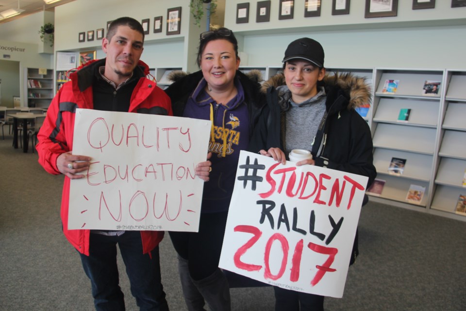 (From left) Collège Boréal first-year dental hygiene student Genevieve Faucon, Cambrian College first-year community and justice services student Rosemarie Thompson and Cambrian College first-year child and youth care practitioner student Roland Periard were among about 40 student who took place in demonstration about the college faculty strike Nov. 16. (Heidi Ulrichsen/Sudbury.com)