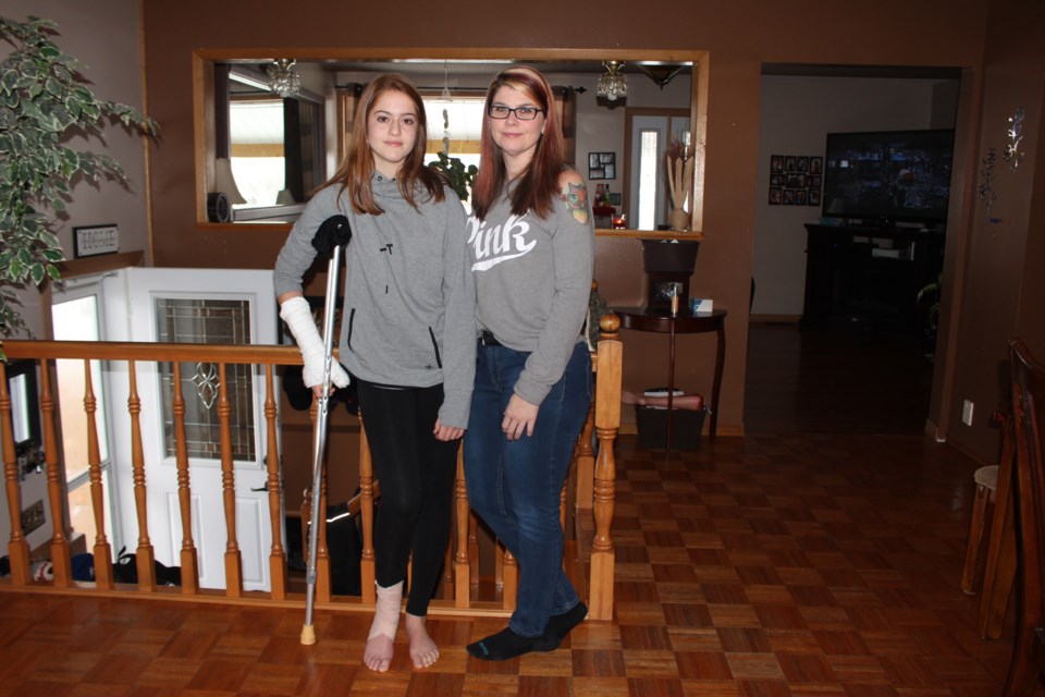 Logan Therrien, 13, has a cast and is on crutches after she was injured fighting off a would-be home invader on Nov. 17. Her mom, Lisa Comeau, is very proud of her daughter. (Gia Patil)