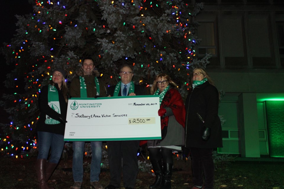 Huntington University kicked off the holiday season on Nov. 23 with their annual tree lighting ceremony and made a $2,500 donation to Sudbury & Area Victim Services. (Photo: Matt Durnan)