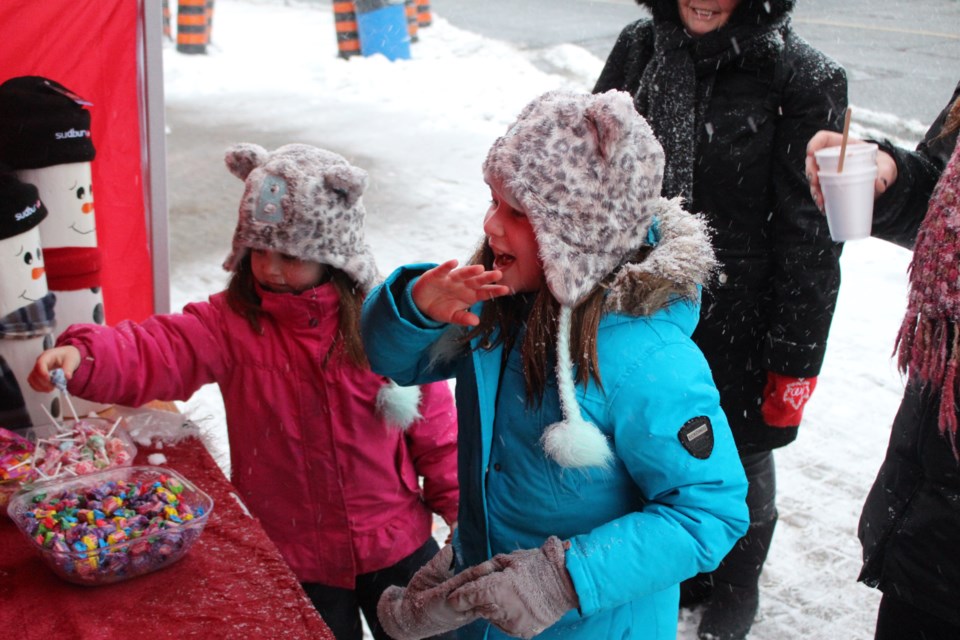 The streets of Downtown Sudbury are filled with smiling faces as Sudburians prepare the arrival of the big guy in the red suit. (Matt Durnan/Sudbury.com)
