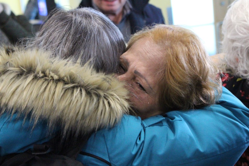 Noura Jallouf sheds a joyful tear as she and her daughter Jinan and granddaughter Pamela were welcomed to Sudbury on Dec. 13. (Matt Durnan/Sudbury.com)