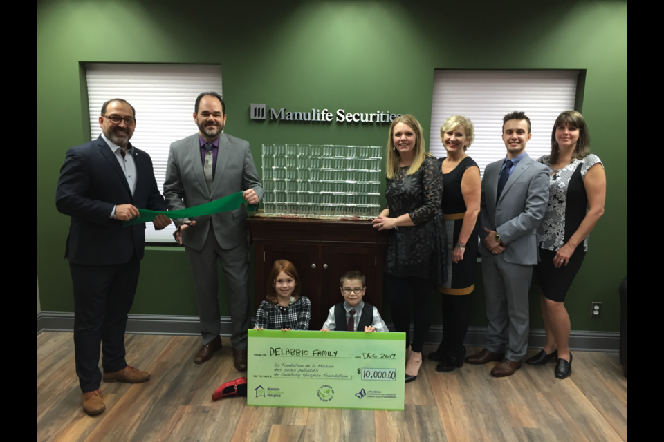 To commemorate the grand opening of Manulife Securities Incorporated's new branch in the Manulife Securities Building in downtown Sudbury, Anthony Delabbio and his financial team donated $10,000 to Maison McCulloch Hospice. In the photo are, from left to right, Sudbury MPP Glenn Thibeault, Anthony Delabbio, Carla Delabbio, Sherry MacDougall, Alex Fievoli and Charmaine Guerette. (Supplied)
