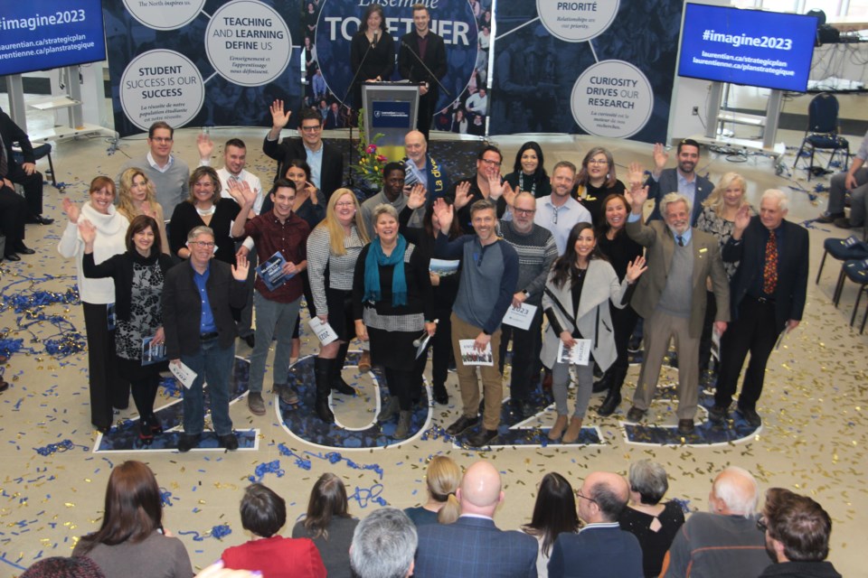The group of Laurentian University students, staff and faculty members who shared the 25 desired outcomes of the 2018-2023 strategic plan ham it up at a Jan. 17 press conference. (Heidi Ulrichsen/Sudbury.com)